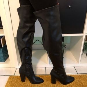 All black knee high boots.